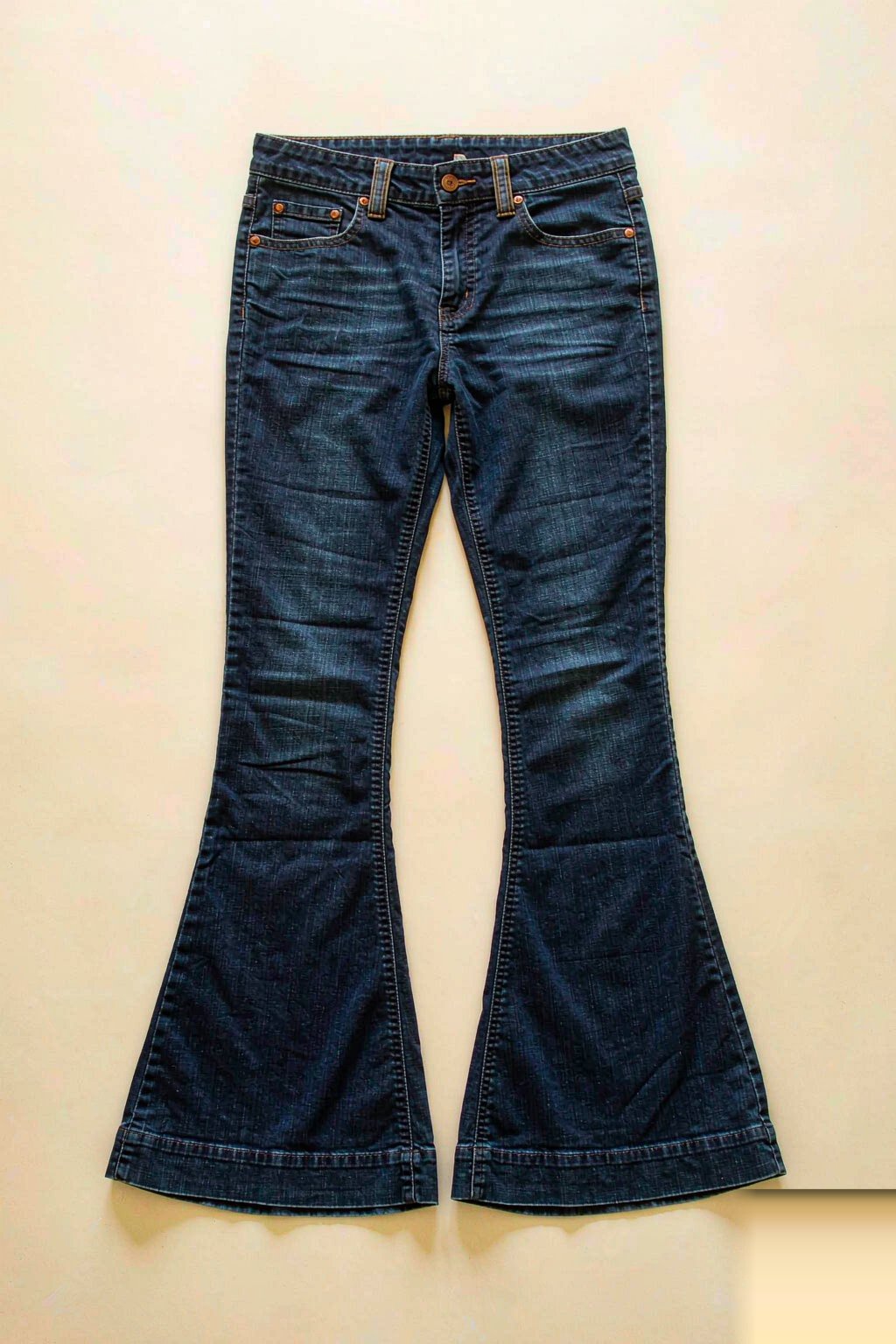 The Eight Fits The Bootcut Jean — Deep Indigo laid flat, showing the leg opening and rise