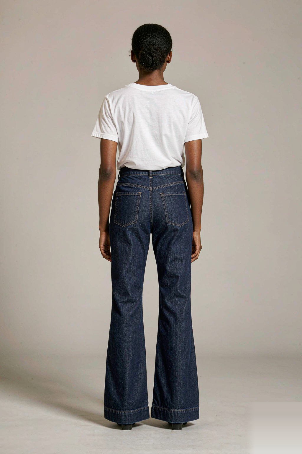 The High-Rise Flare Jean — Indigo The High-Rise Flare Jean — Indigo seen from behind