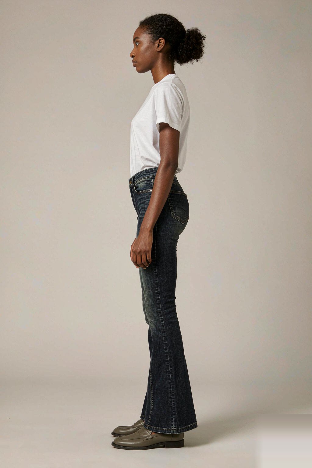 The High-Rise Flare Jean — Indigo The High-Rise Flare Jean — Indigo seen from the side