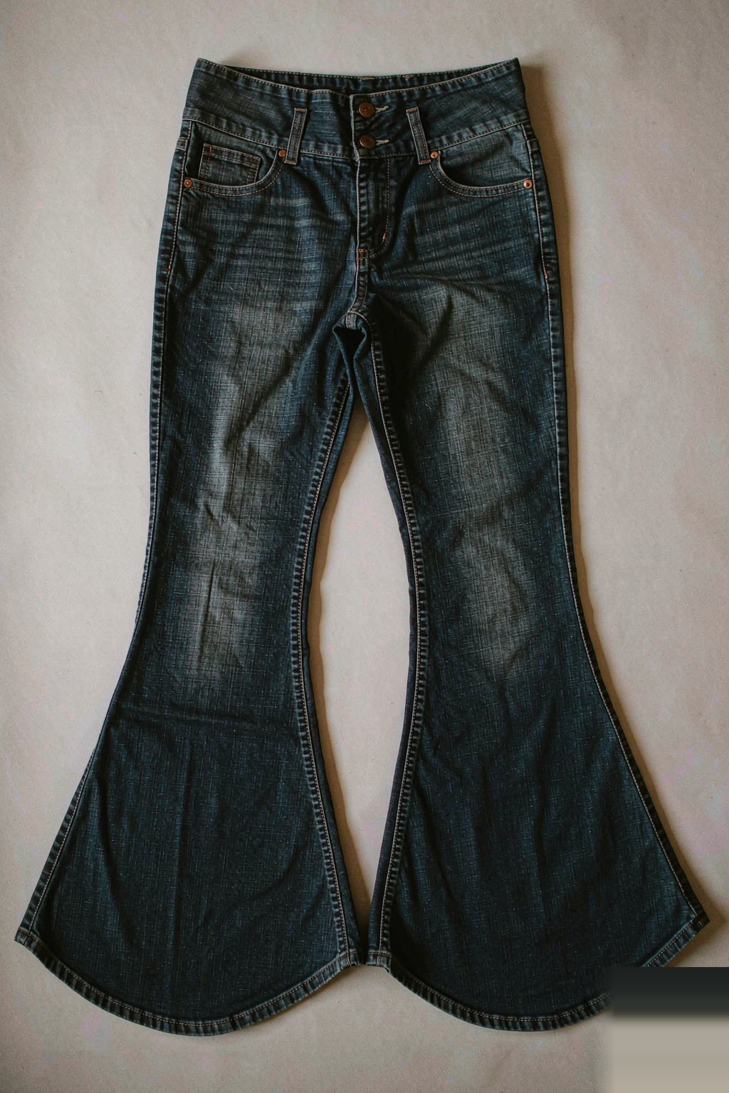 The Eight Fits The High-Rise Flare Jean — Indigo laid flat, showing the leg opening and rise