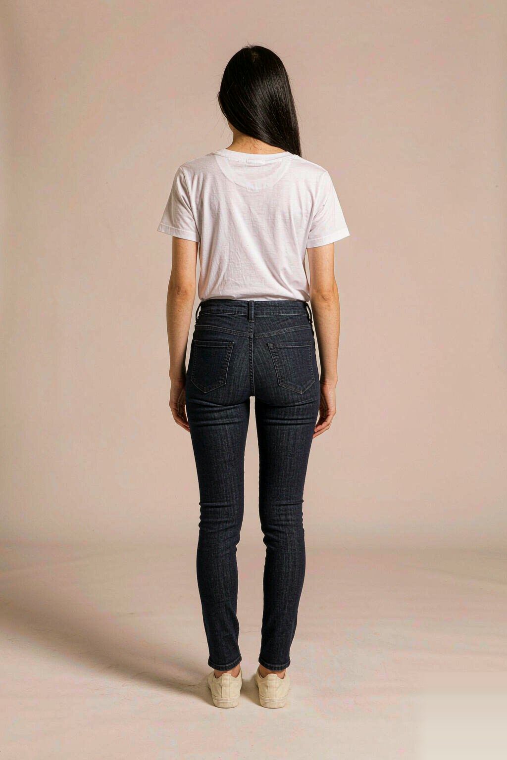 The Mid-Rise Skinny Jean — Dark Indigo The Mid-Rise Skinny Jean — Dark Indigo seen from behind