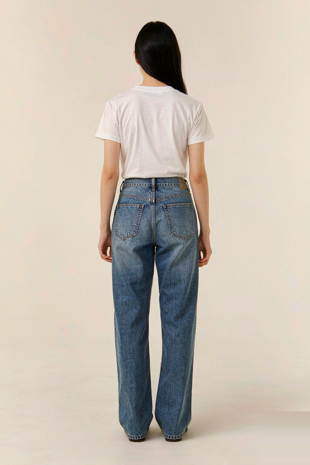 The Classic Straight Jean — Mid Blue The Classic Straight Jean — Mid Blue seen from behind